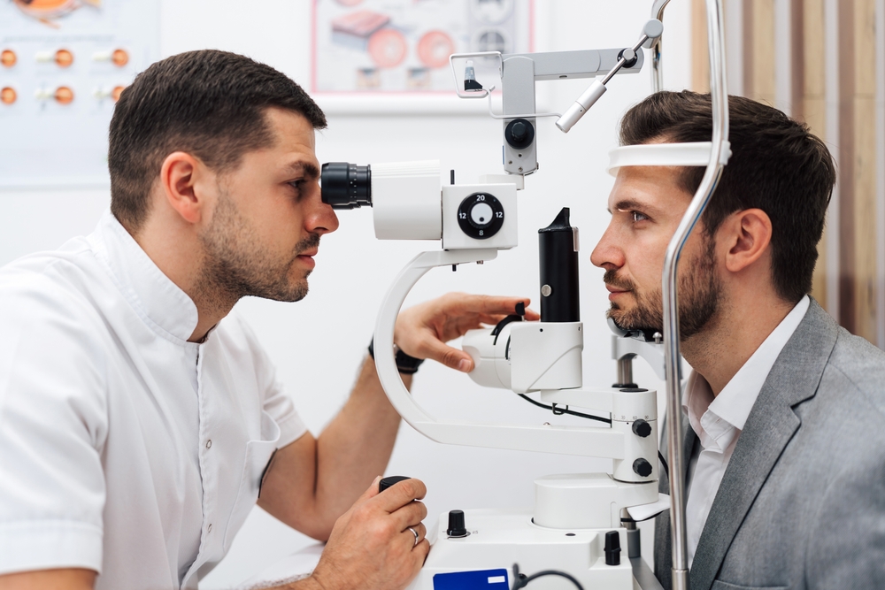 Eye Doctor at work looking into the eyes of an optometry patient at Silk Vision