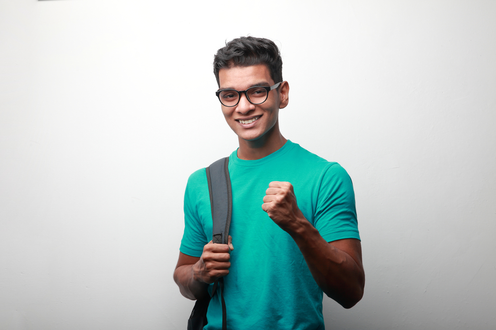 Older Teenager Shown With Glasses Excited About LASIK Eye Surgery By The ophthalmologist at Silk Vision & Surgical Center in Virignia