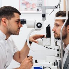 Eye Doctor at work looking into the eyes of an optometry patient at Silk Vision